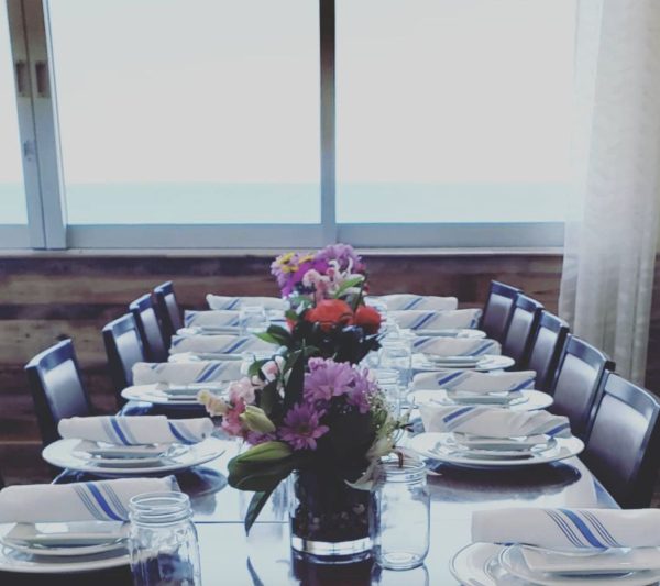 A table set for dinner near a window