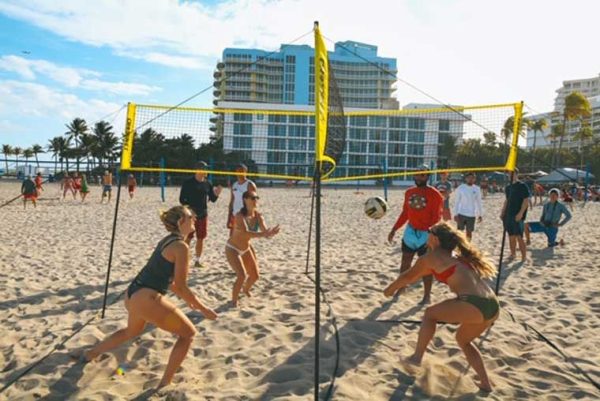 People playing volleyball at the beach
